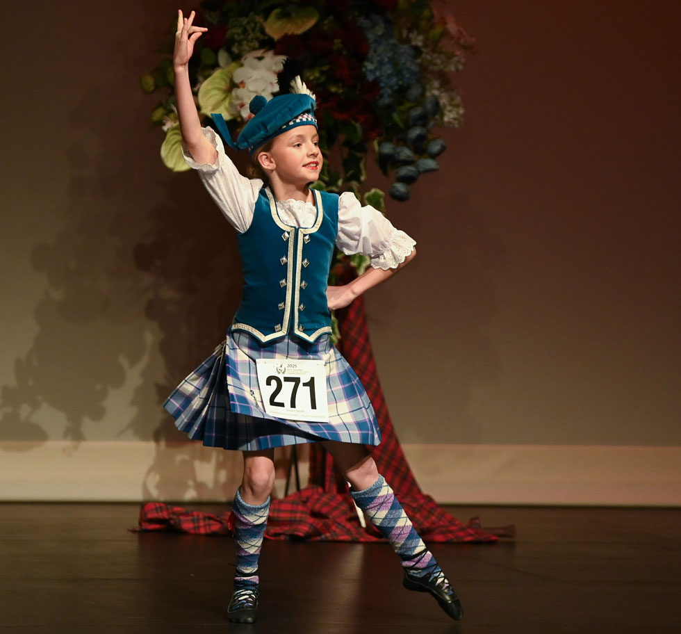 A highland dancer performing on stage