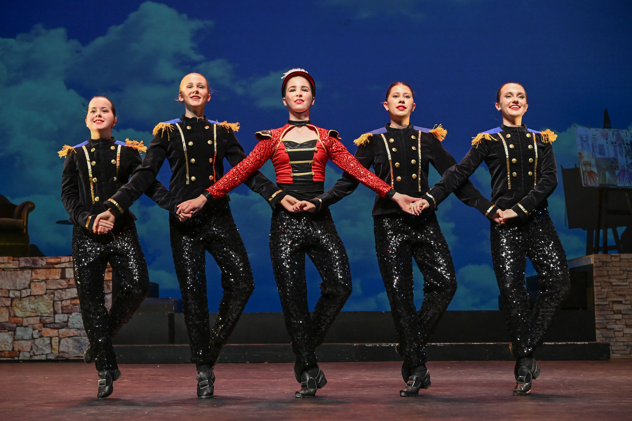 Five highland dancers perform for the production of Cinderalla. They wear soldier uniforms.